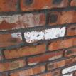 Lead paint on a recycled brick used to build a 1972 home.